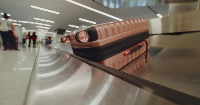 Luggage on Airport Conveyor Belt in Terminal