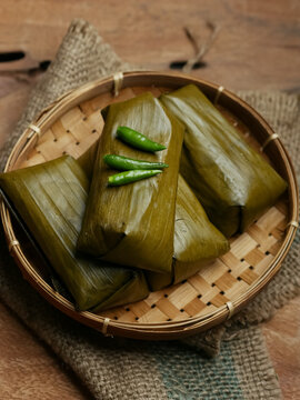 Lontong oncom, Indonesian traditional food made from compacted rice with oncom filling made from fermented soybeans. Wrapped with banana leaves. famous food or starter for ifthar or takjil in ramadhan