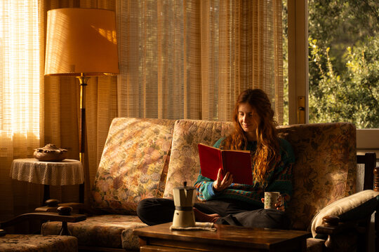 Woman reading on sofa