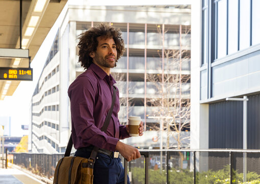 Man confident wait for train  station 