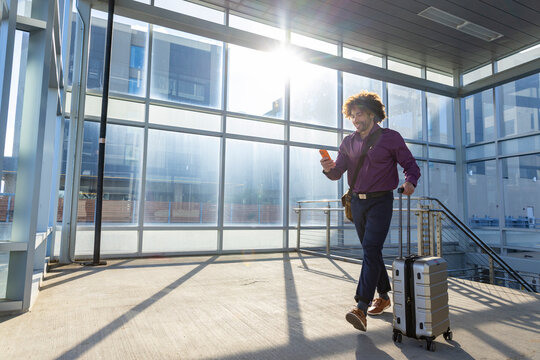 Man walk with cell phone  train station indoors