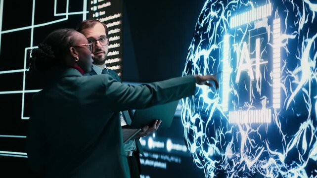 Autonomy concept, AI machine learning and engineering team looking at self writing code on screen, artificial intelligence and teamworking colleagues reviewing self sustaining AI model