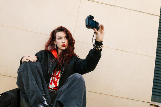 Alternative gen z woman vlogging outdoor lifestyle