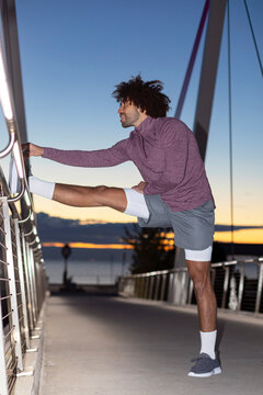 Athlete stretches running sunrise coast Flash