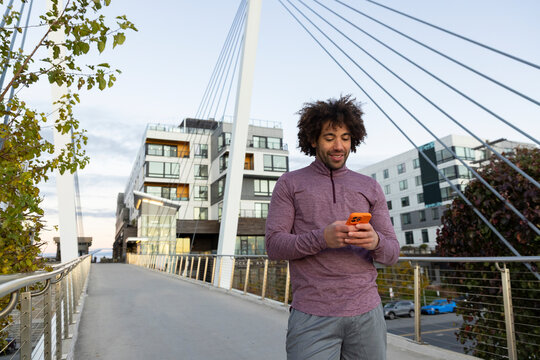 Man portrait cell phone with smile suspension bridge 