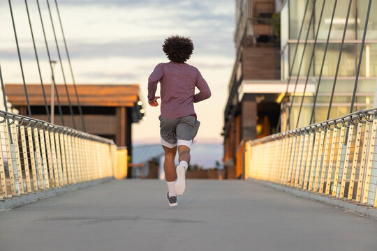 Black runner on Bridge Sunrise back view 