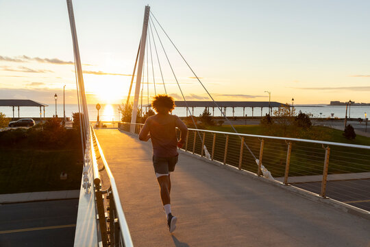Black runner on Bridge Sunrise to beach