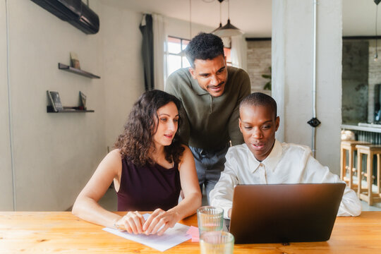 Co-workers discuss ongoing work tasks