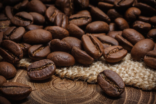 Coffee beans on sack wood table (Arabica)