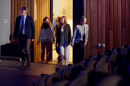 Individuals enter the amphitheater