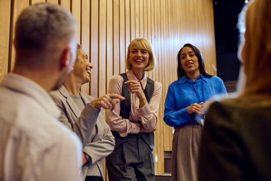 Coworkers chat in the amphitheater