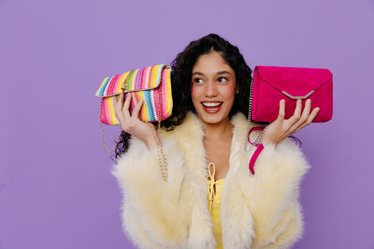 Woman between two stylish fashion purses