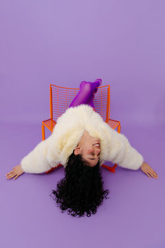 Playful woman  relaxing upside down