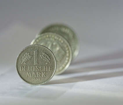 Stack of old German Deutsche Mark coins from 1978 with metallic texture