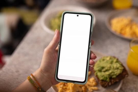 Healthy Breakfast with Avocado Toast, Scrambled Eggs, and Smartphone
