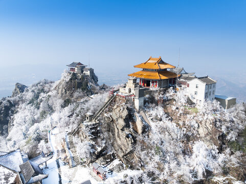 Snow-Covered Mountain Temples with Golden Roofs