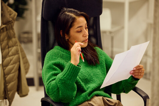 Woman examining paperwork