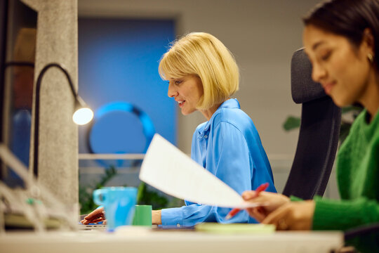 Women operate in a shared workspace
