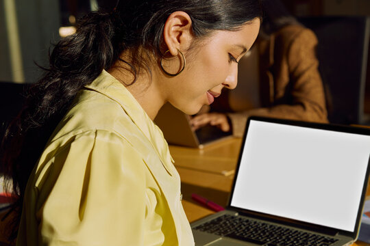 Focused office work with laptop in coworking space