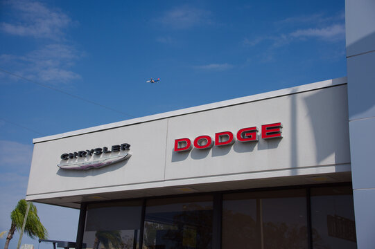 Dayton Andrews Chrysler Dodge Jeep Ram Dealership Sign With American Flag And Jeeps Under Clear Blue Sky. Editorial Use Only February 22, 2026 St. Petersburg, FL USA. Large sign displaying Chrysler, D
