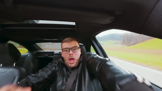 Interior car shot of a distracted driver losing focus and reacting in panic to avoid a crash. Concept of road safety, distraction while driving, risky behavior and near accident situation.
