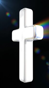 A white Christian cross symbol with a glossy finish and lens flare.