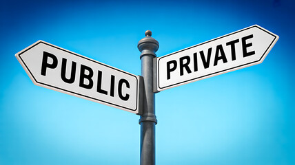 Fototapeta premium Public and private street sign against blue sky representing choice between sectors concept