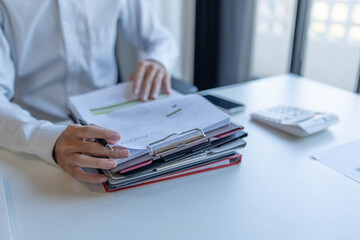 Fototapeta premium Businessman doing work reading documents