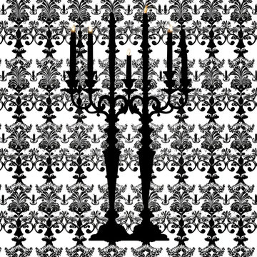 Black silhouettes of two ornate candelabras candelabrum