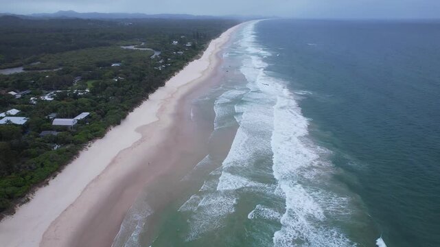 Aerial View Of Brunswick Heads Main Beach With Simpsons Creek, Dense Green Forest, And Coastal Homes. NSW, Australia.