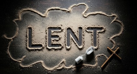 A wooden cross and a sand clock on a dark wooden table.