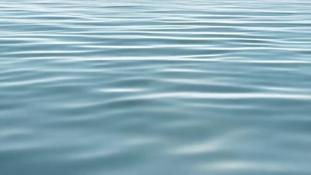 Calm blue water surface ripple reflection serene sea with gentle ripples and soft sunlight