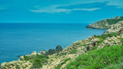 Fototapeta premium Scenic Tropical Coastline View with Turquoise Water and Green Cliffs