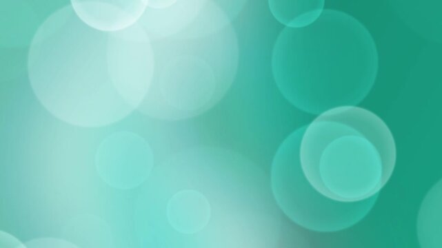 A close-up view of translucent circles on a green background with varying opacity and size