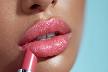 Naklejka premium Close up of glossy pink lips with lipstick application, luxury cosmetics beauty concept showcasing makeup artistry, skincare, elegance and premium beauty products