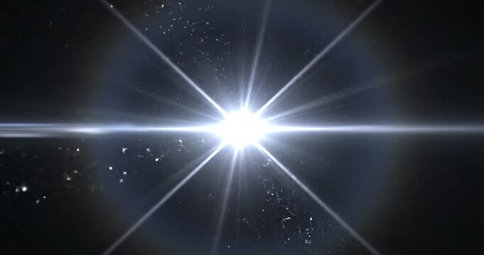 Bright starburst illuminating a dark cosmic background with scattered celestial particles