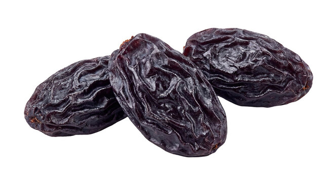 Three dark jumbo raisins isolated on white background