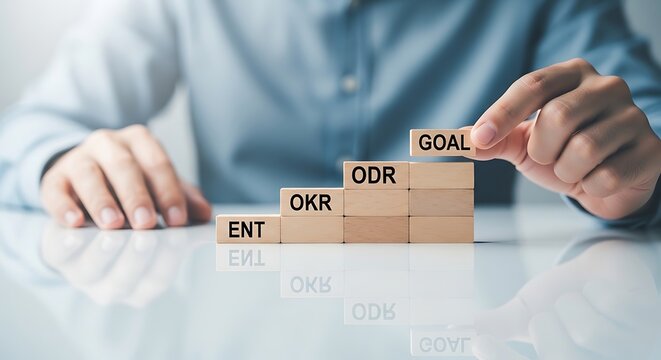 Businessman building success strategy with wooden blocks
