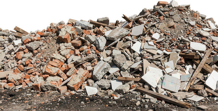 A large pile of construction debris including broken bricks concrete fragments plasterboard pieces and wooden planks is visible rubble waste demolition construction materials