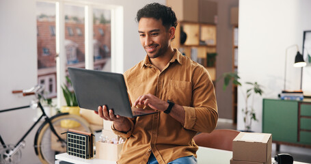 Business, logistics and man in office, laptop for inventory management and online order. Person,...