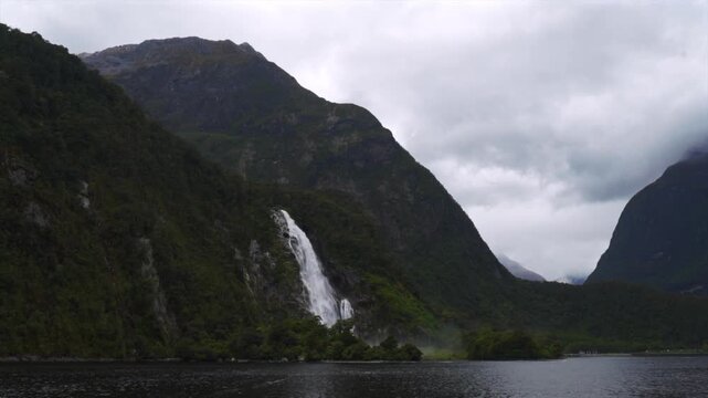 Milford Sound Lady Bowen Falls Piopiotahi Ata Whenua Milford Sound Southern Alps South Island Fjord Fiordland National Park Cruise boat New Zealand Aotearoa Spring morning Freshwater Basin landscape