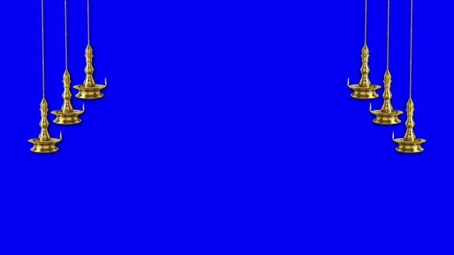 Traditional Hanging Brass Deepas on Blue Screen Intricate golden oil lamps swaying gently against a chromakey blue background, ideal for festive video overlays.