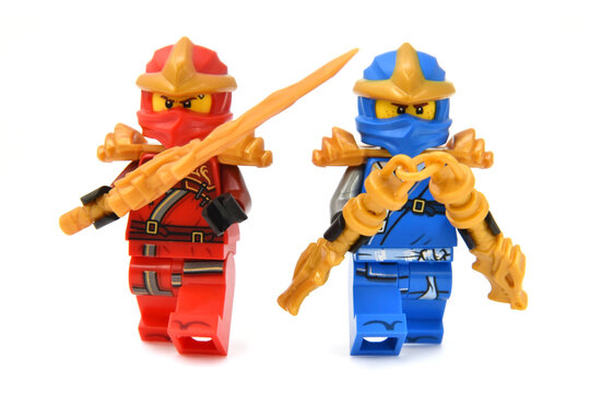 Editorial illustrative image of meeting of two lego ninjago minifigures fire ninja Kai and Jay isolated on white. Popular lego theme to 15 Years edition.