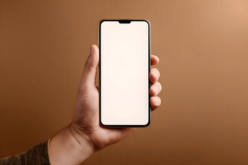 Displaying a blank smartphone held by a hand against a brown background