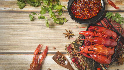 Cooked Crayfish with Fresh Herbs and Spices on Wooden Table