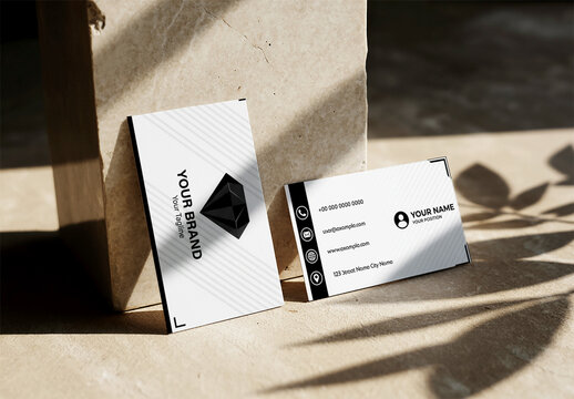 Elegant Business Card Mockup Leaning Against a Natural Stone Block