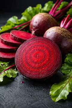 Freshly sliced beetroot on a black surface