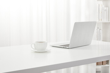 Fototapeta premium Elegant Office Workspace with Coffee and Laptop