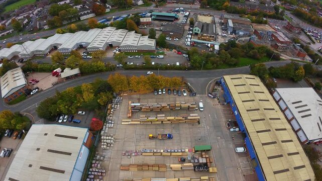 Lumber Yard Overview. Rustic Lumber Storage Captured From Above. Aerial View Of Bustling Timber Distribution Area. Overview Of Busy Sawmill Site With Timber Storage And Activity From Above