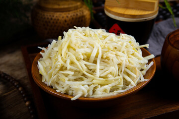 Crispy Pickled Bamboo Shoots on Wooden Plate